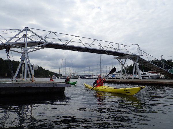 Kayaking under a bridge in Oslo. Photo